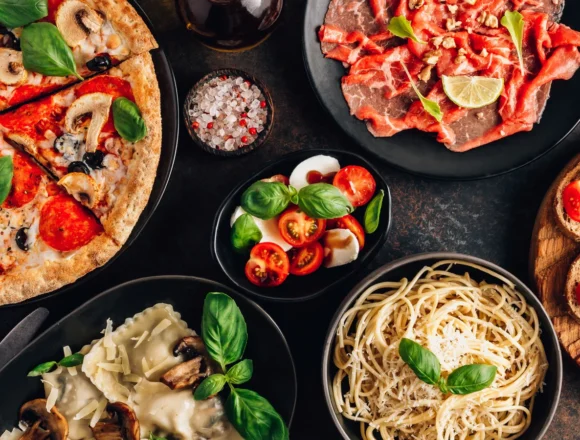 Full,Table,Of,Italian,Meals,On,Plates,Pizza,,Pasta,,Ravioli, 12 Italian Dishes Everyone Should Know How to Cook, According to Chefs